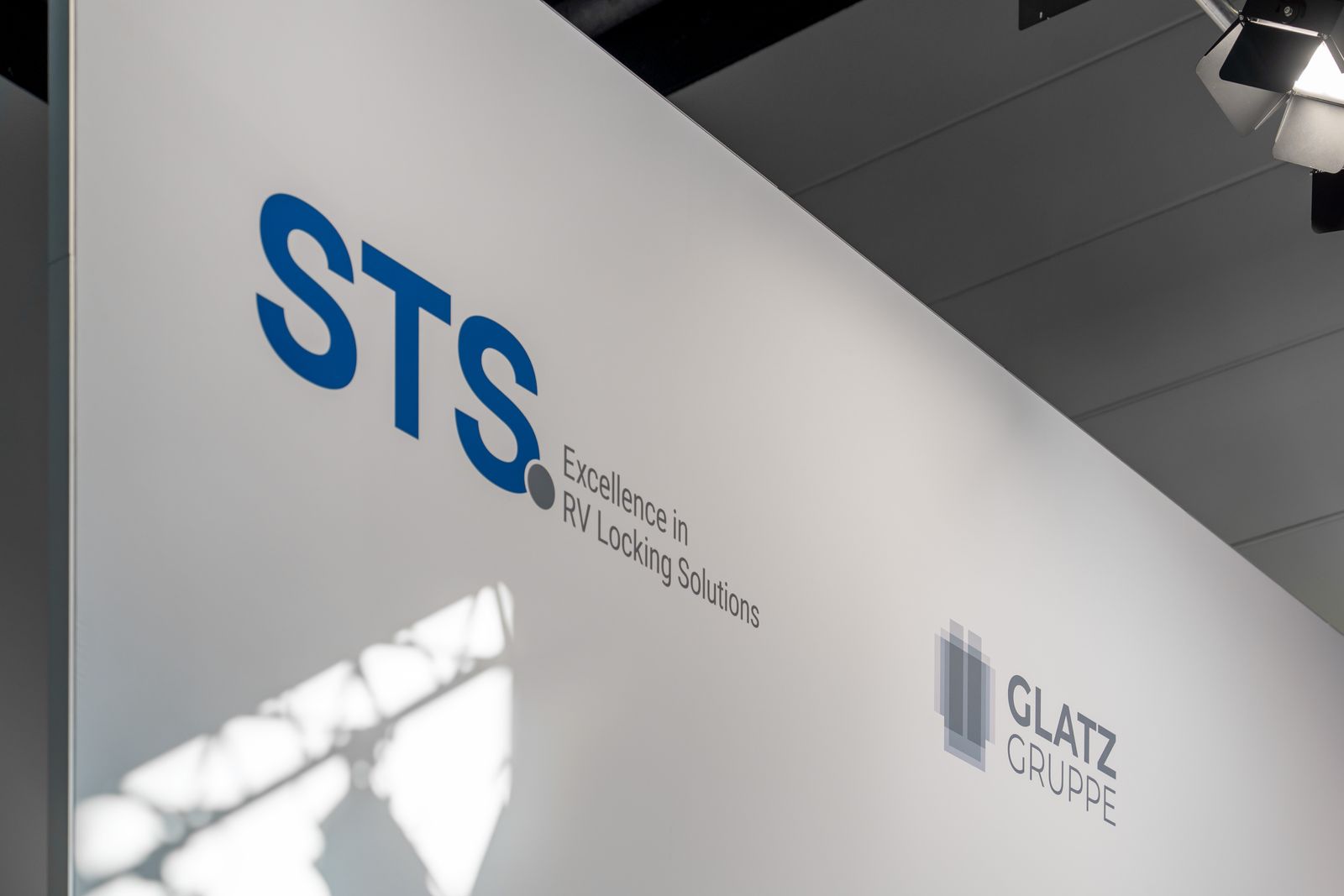 STS and Glatz-Gruppe logos at the STS booth